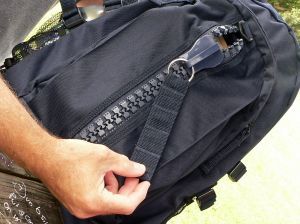 A black backpack with a crazy big zipper. Like Crazy big!